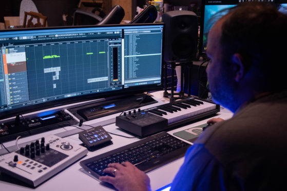 sound designer working at computer