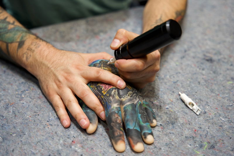 close up of tattoo artist